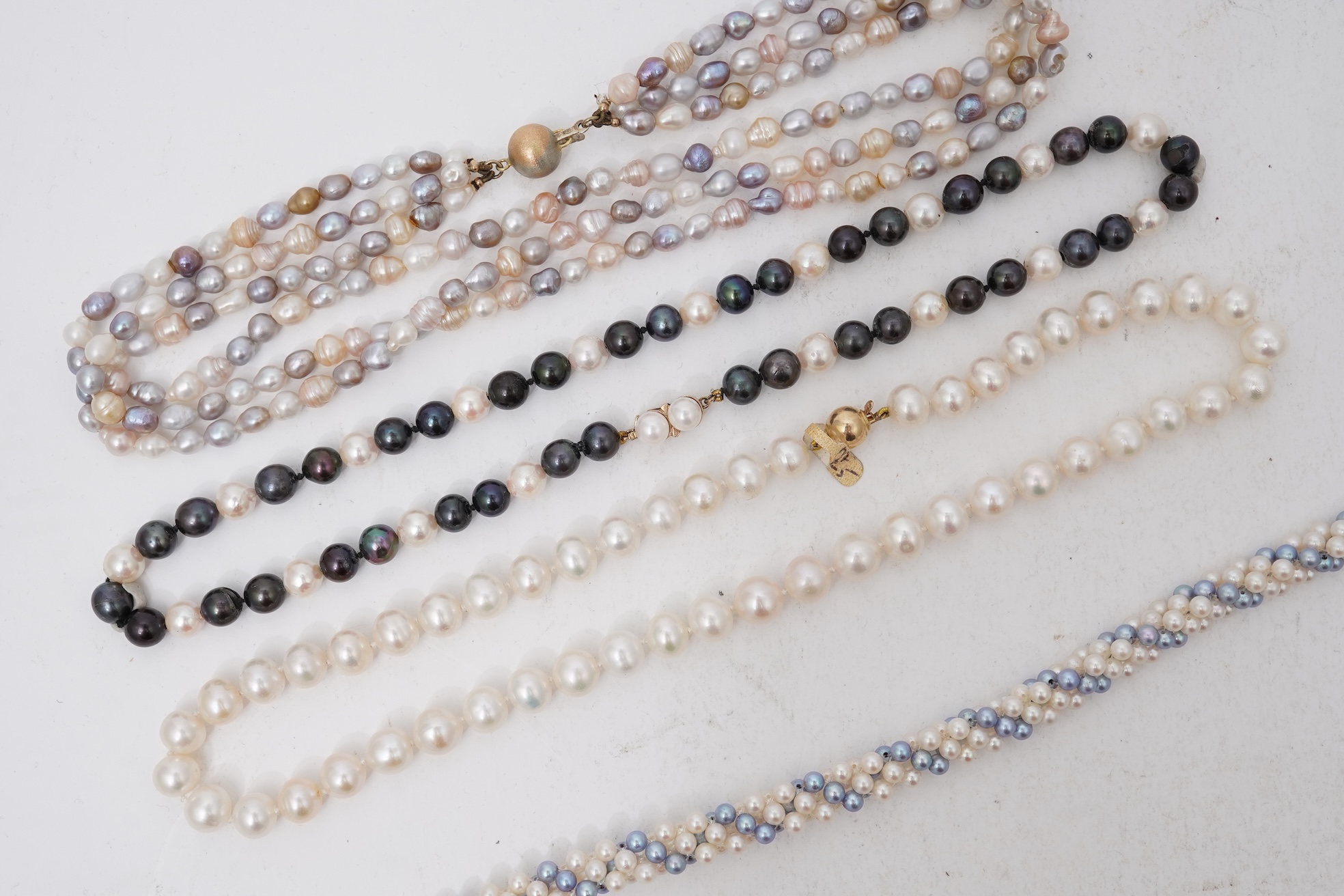 A collection of four cultured pearl necklaces